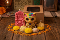 Gato de Muertos candle set styled on rustic table with Día de los Muertos theme